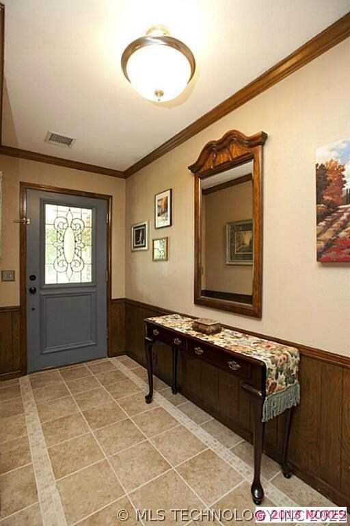 Newer tile in entry. Coat closet off the entry.