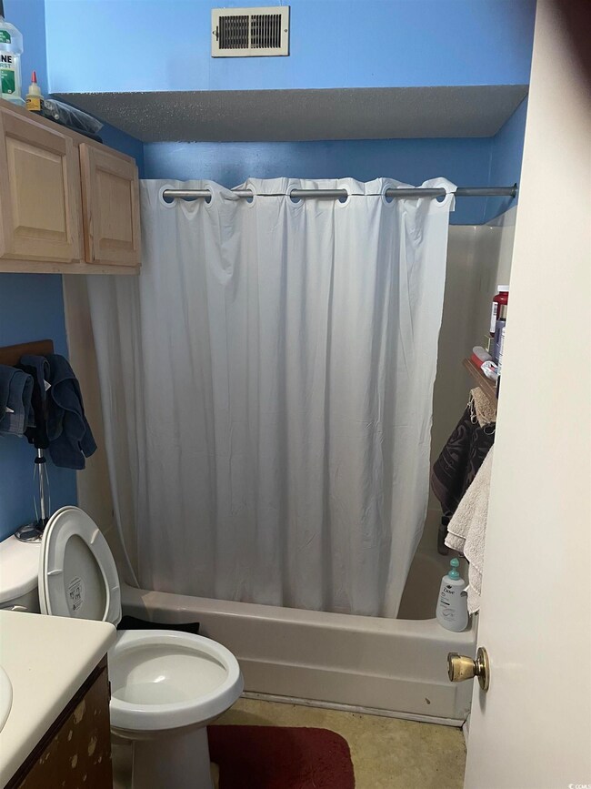 Full bathroom with shower / tub combo, tile patter