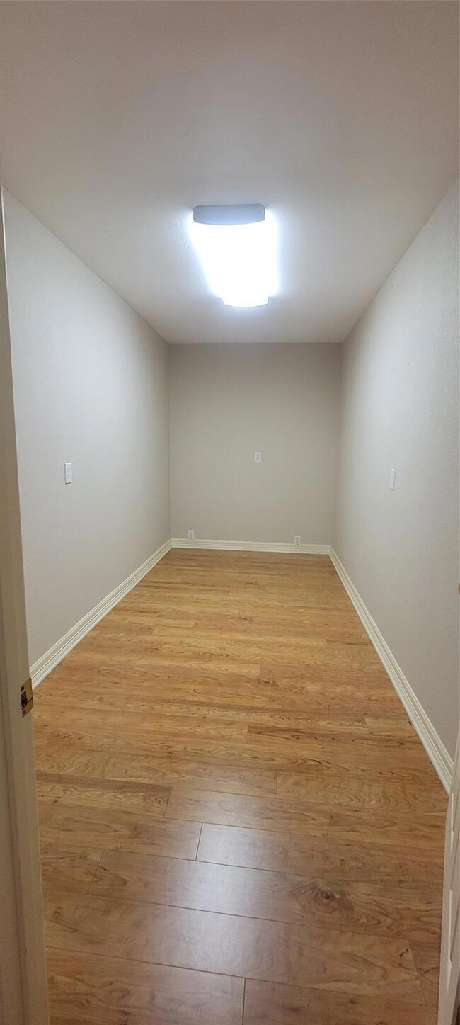 Spare room with hardwood / wood-style flooring