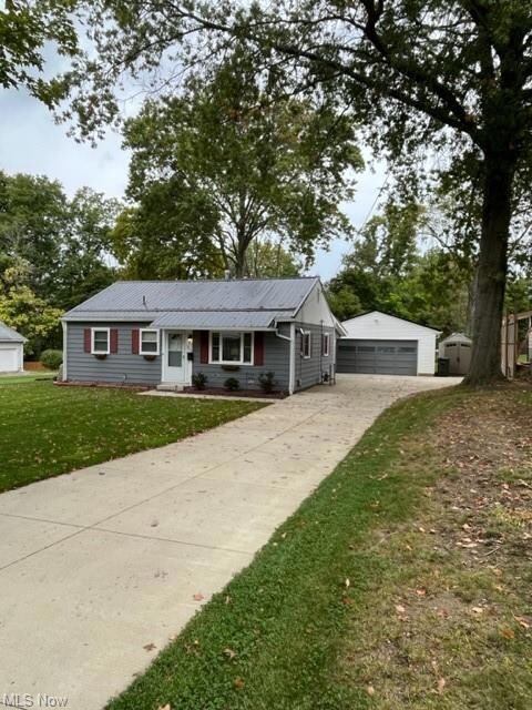 newer concrete driveway & sidewalk & patio in back