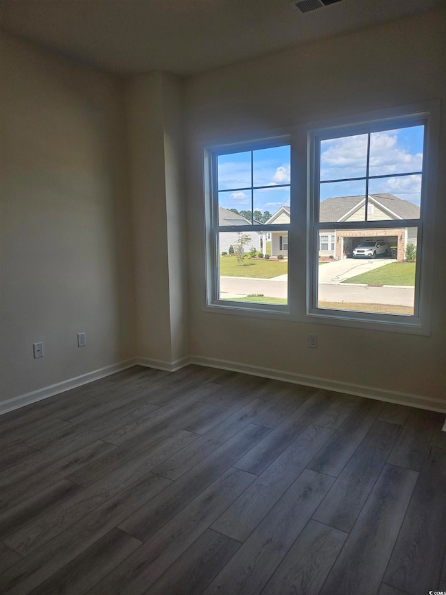 Secondary bedroom on main floor with LVP flooring Please note photos are of similar home plan, colors and options vary from home