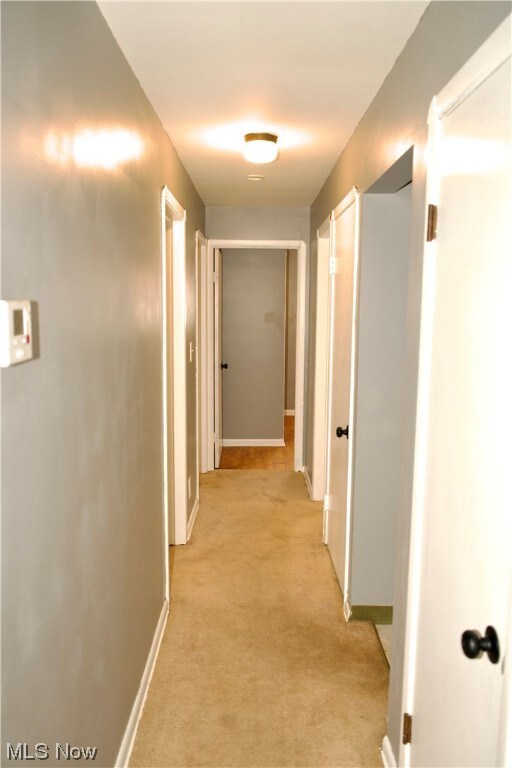 Hallway with light carpet