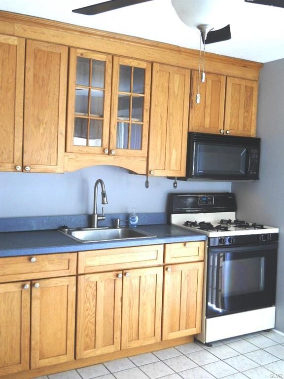 Kitchen has a ceiling fan