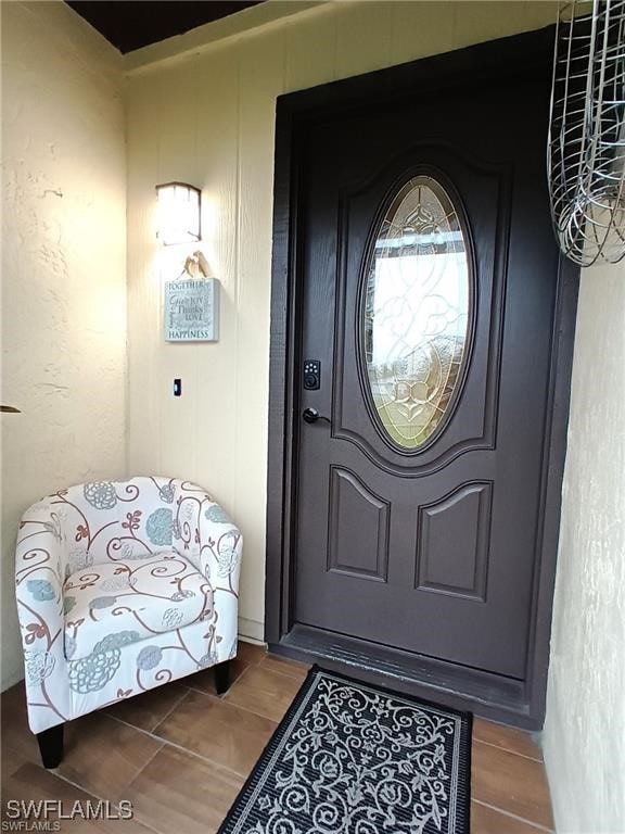 Doorway to property with covered porch