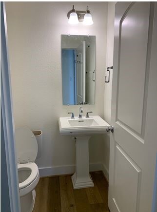 Private powder bath located far from the family room