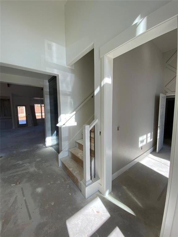 ENTRY WITH STUDY AWAITING BARN DOOR