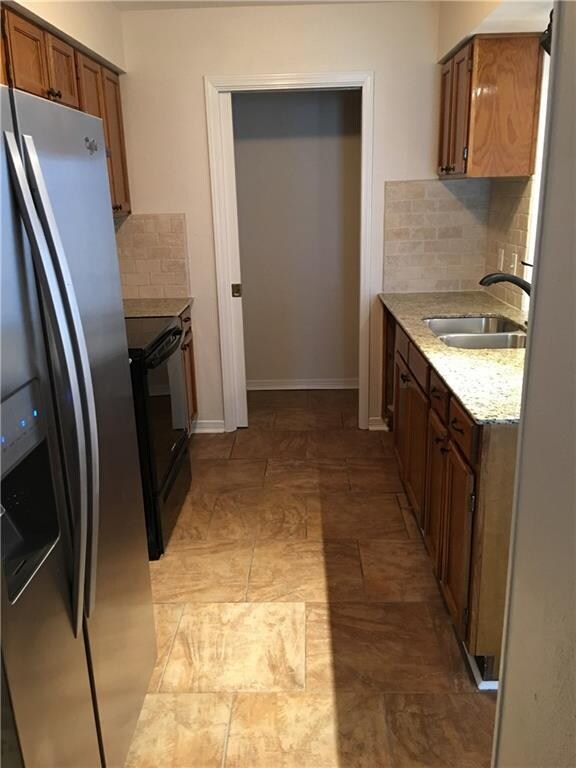 Laundry closet located off the kitchen