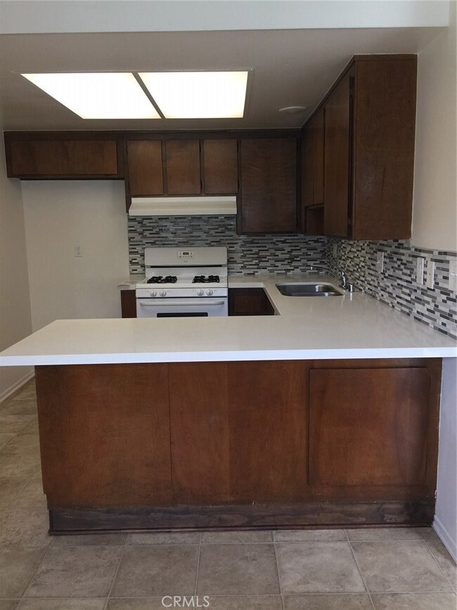 Newer Quartz Counters with Tile Backsplash