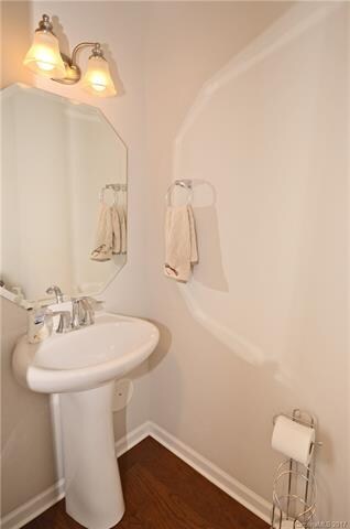 Half Bath with wood floor for guests.