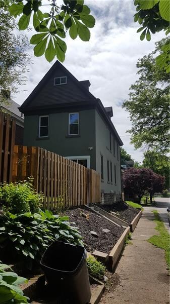 fenced back yard with deck