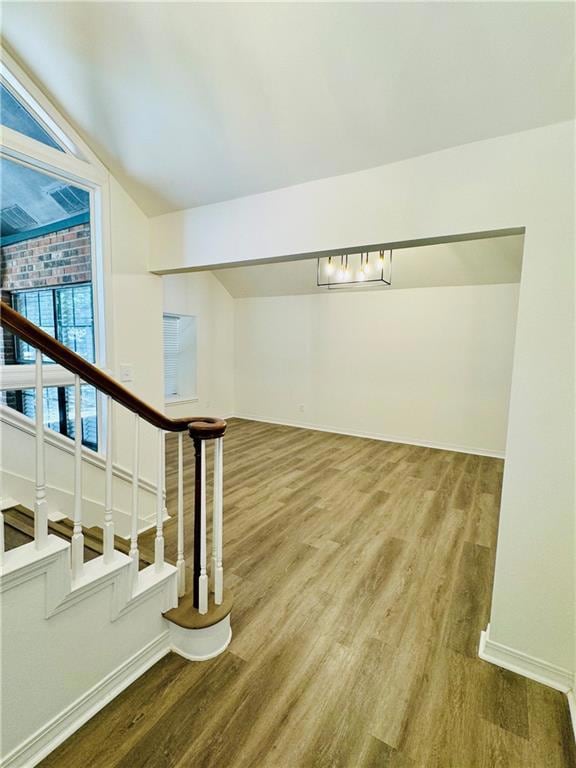 Hall with hardwood / wood-style floors