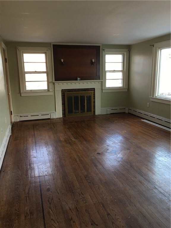 first floor living room/fireplace...door to second