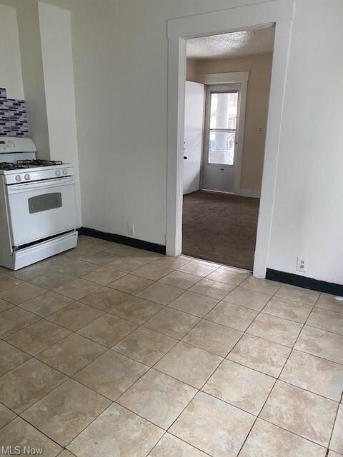 Downstairs unit kitchen looking into living room.