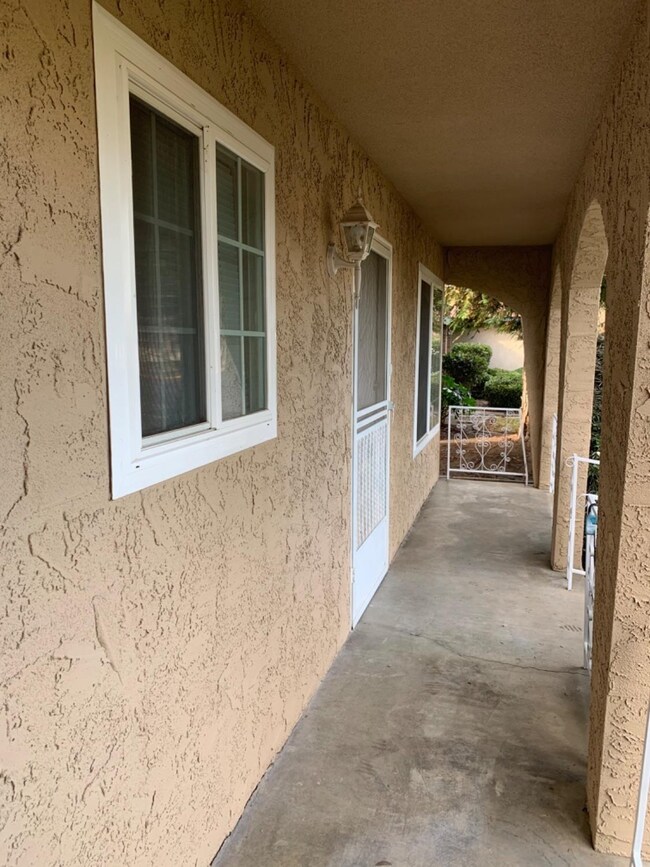 Covered porch with decorative railing