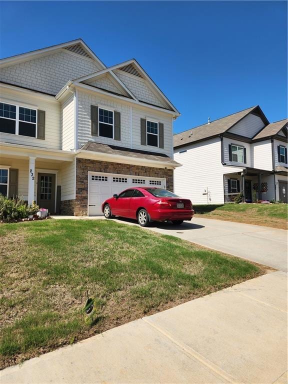 Craftsman-style house with an attached garage, sto