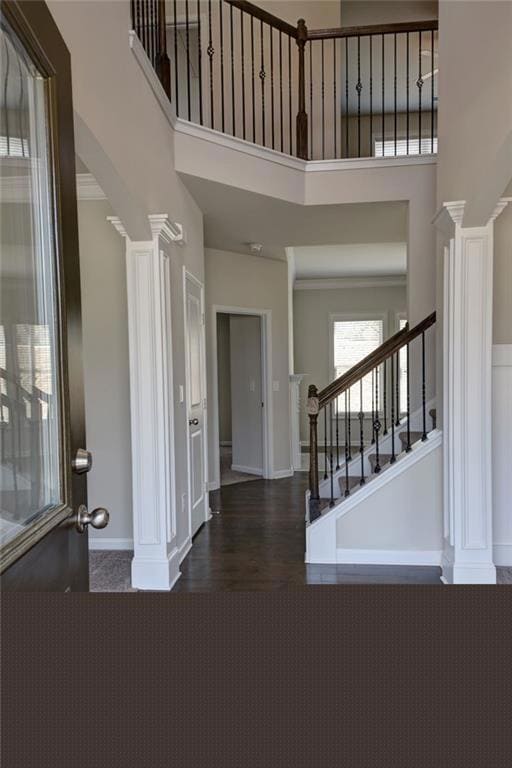 Entryway featuring wood finished floors, stairs, a