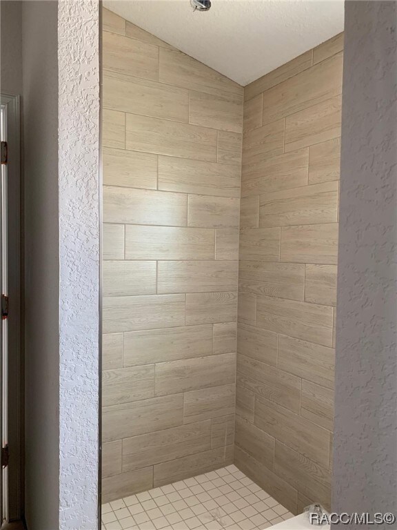 separate tile shower in owners bathroom