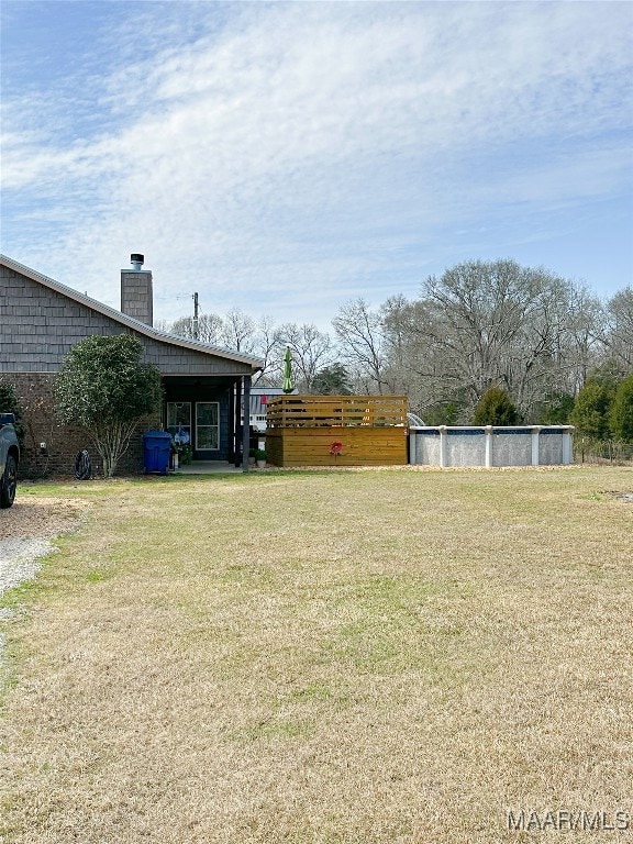 Side view from detached garage of rear covered por
