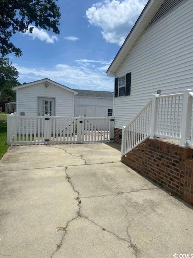 Driveway, side entrance and shed