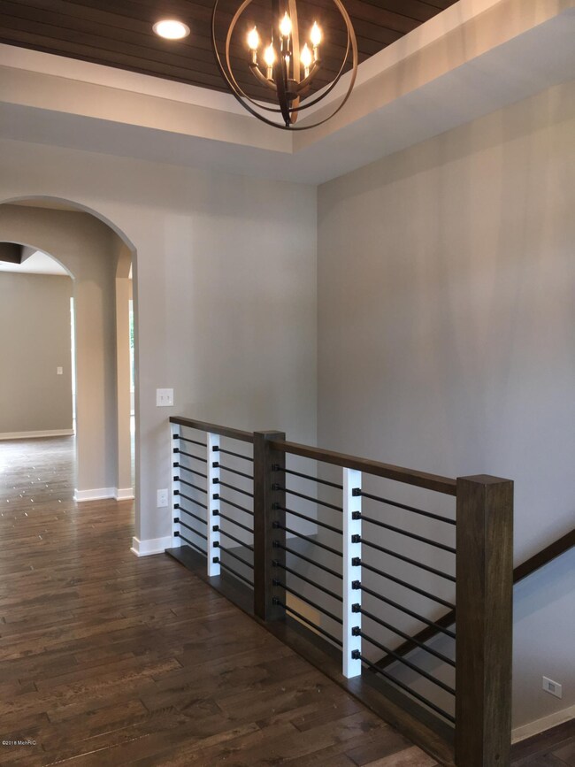 Foyer with horizontal stair railing