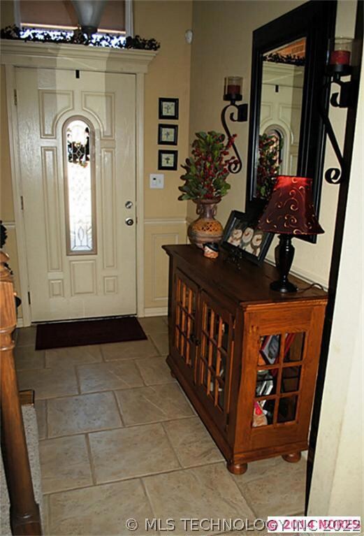 Foyer with tile floor