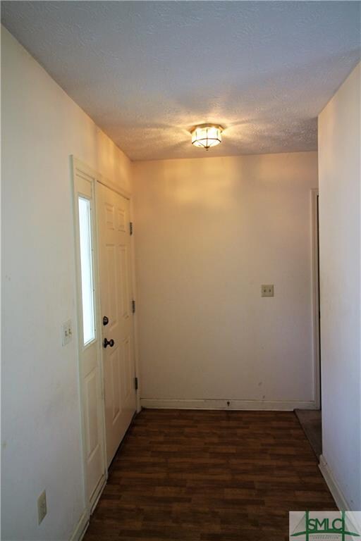 Entry with Wood Laminate Flooring.