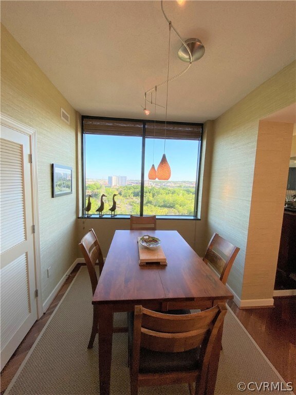 Dining Room with chandelier and stunning River vie