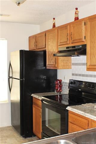 Kitchen with Black Smooth Top Range, NEW counterto