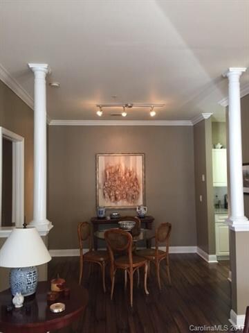 Dinning room with columns and upgraded lighting