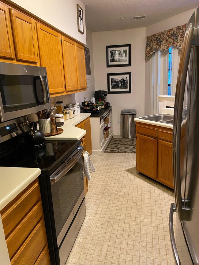 Kitchen featuring appliances with stainless steel 