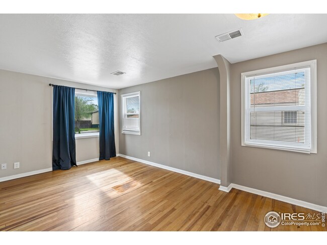Living room with original hardwood floors.