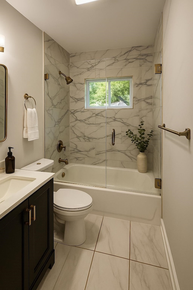 Full bath featuring vanity, bath / shower combo with glass door, marble look tiles, and toilet