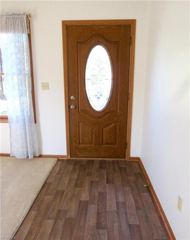 Leaded glass design front door and newer flowing a