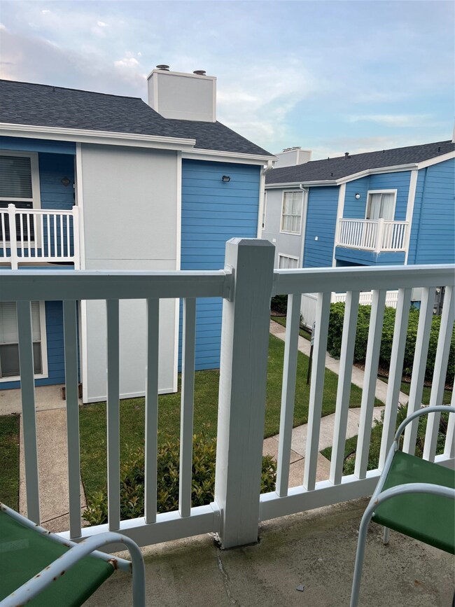 Balcony off the front porch faces east.