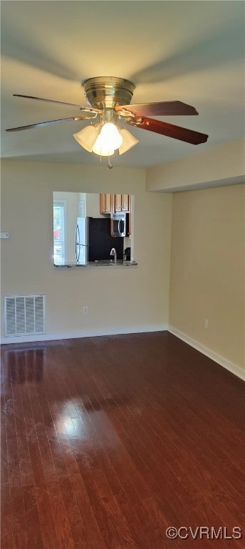 Unfurnished living room with ceiling fan, wood fin