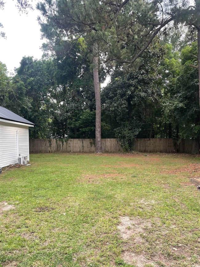 View of yard featuring view of scattered trees