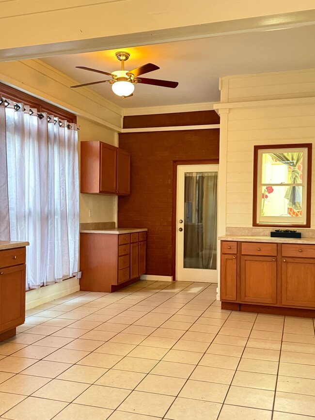 Kitchen featuring light tile patterned floors, a c