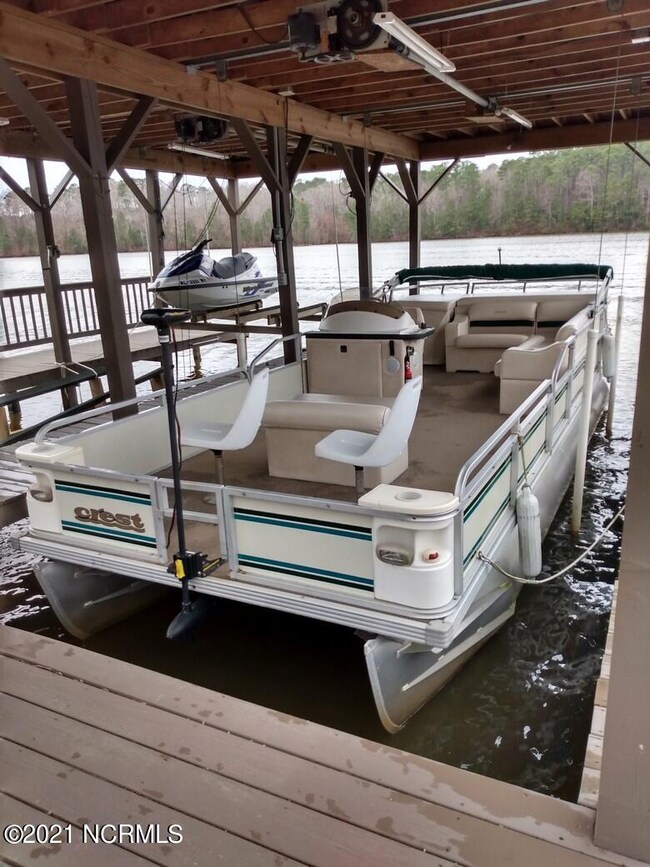 PONTOON BOAT AND BOAT HOUSE AND LIFTS!