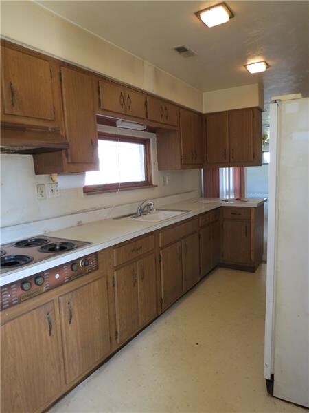 This large kitchen has lots of storage space.