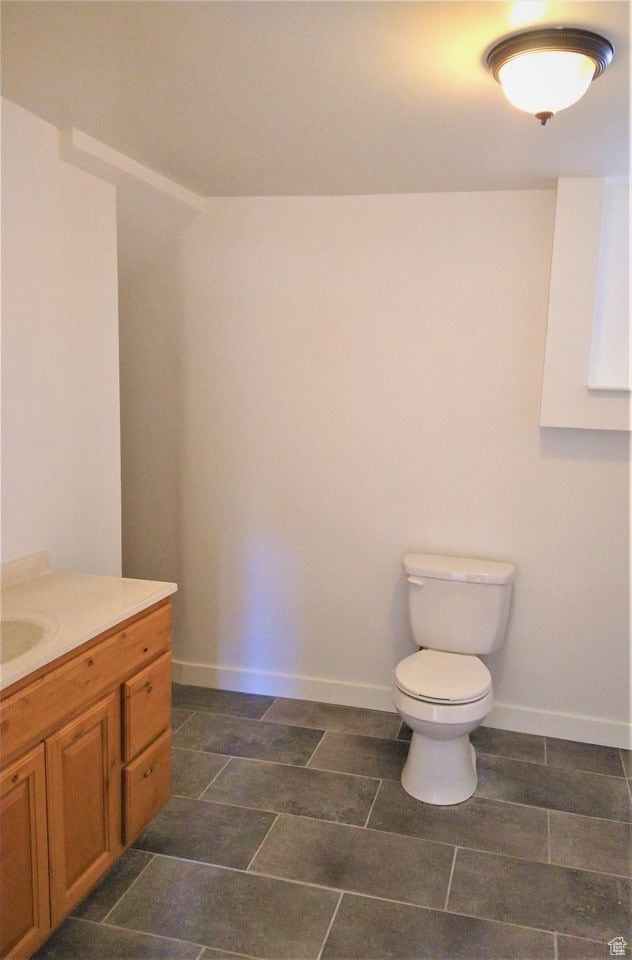 Bathroom featuring vanity and toilet