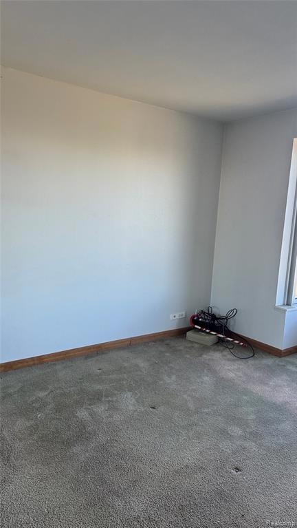 Unfurnished room featuring carpet flooring