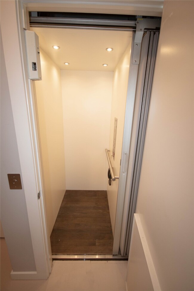 Elevator on first floor near front door.