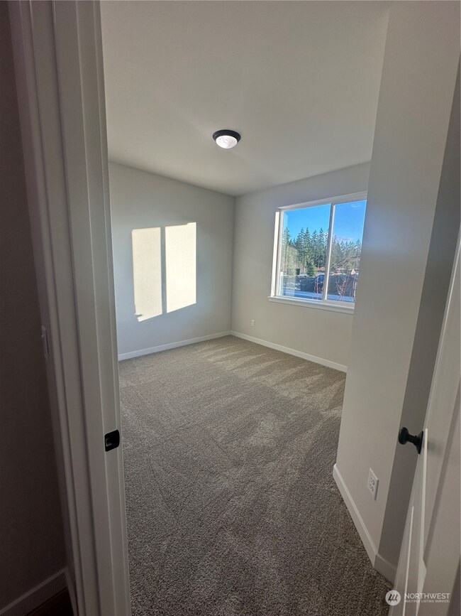 Bedroom 2 Disclaimer: These photos are of another Aurora Home in community. Depictions of home, layout, location or other features, colors and color scheme, materials, fixtures, etc. are for showing purposes only and may not be included in the purchase price and availability may vary.