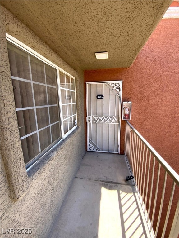 Entrance to property featuring stucco siding