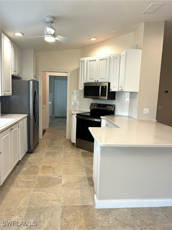 Kitchen featuring appliances with stainless steel
