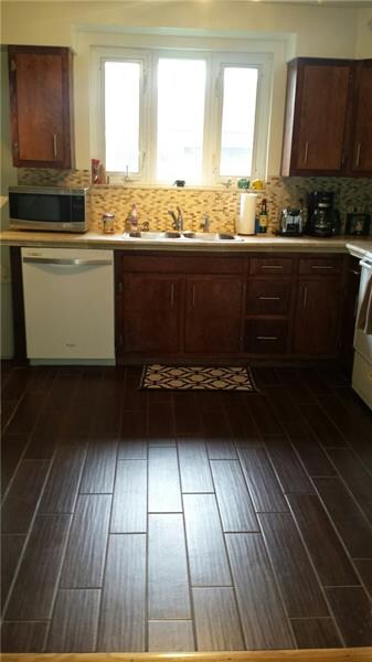 PORCELAIN FLOORS IN KITCHEN WITH TILE BACK SPLASH