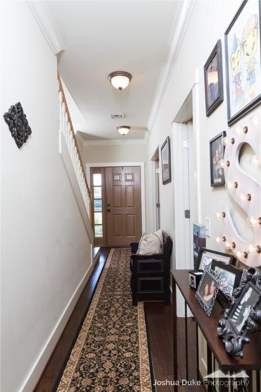Hallway from the front door into the living/dining/kitchen.  Office and full bath are to the right.