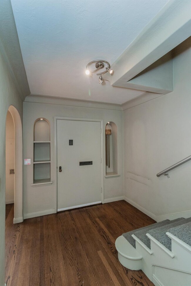Entry w/lighted wall alcoves - The arched passage 