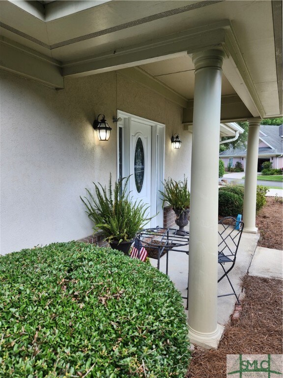 Small Porch with Leaded Glass Door highlight Entry