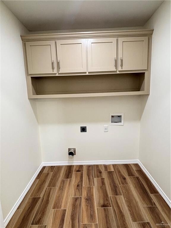 Laundry area with cabinets, electric dryer hookup, and washer hookup